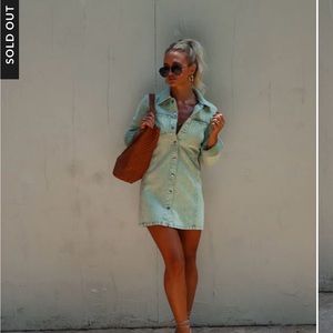 Selling a new with tags, denim dress size large